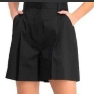 Danielle Bernstein black pleated shorts